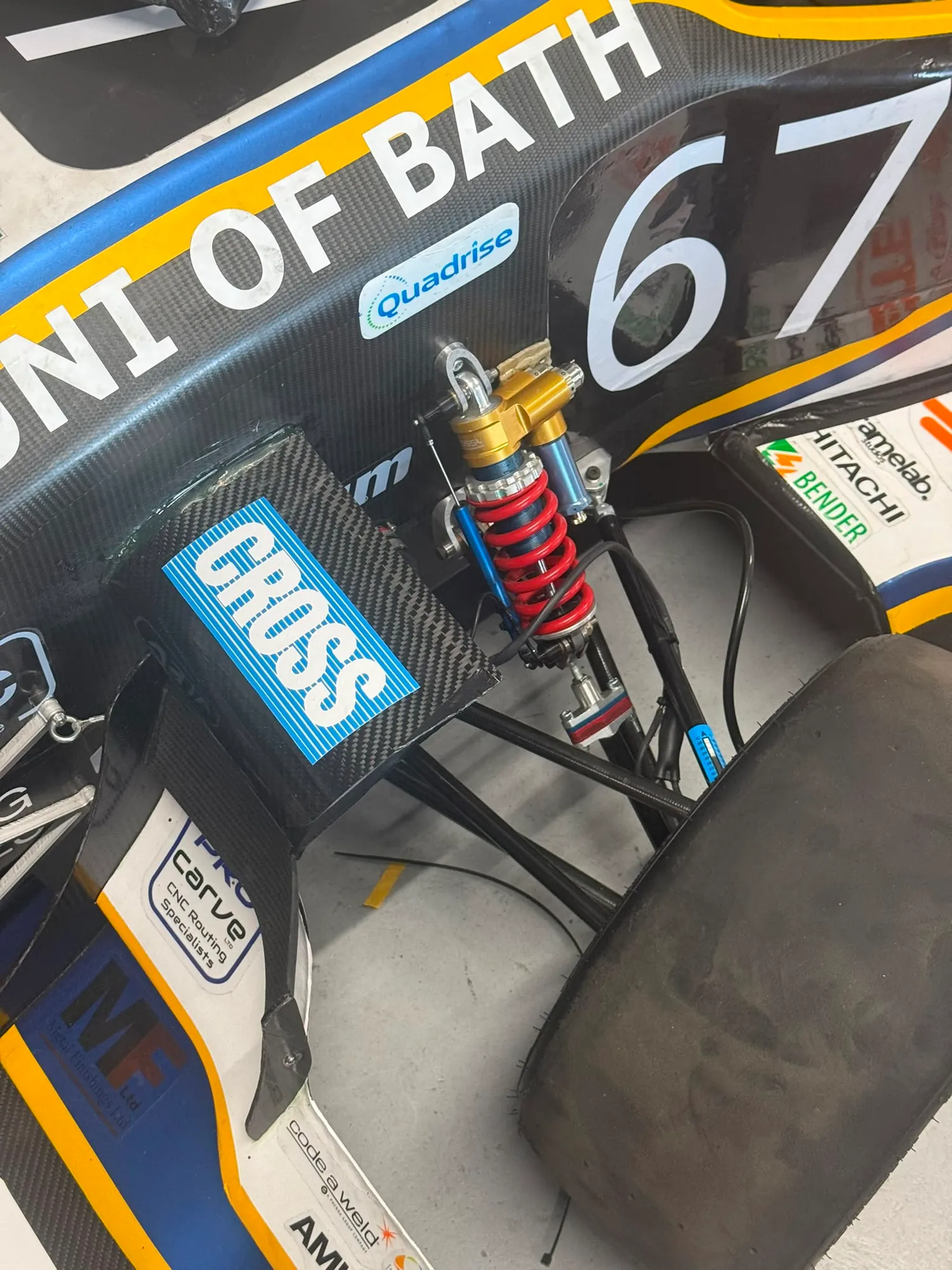The inboard suspension on the car: rocker and damper with the pushrod arriving at the rocker